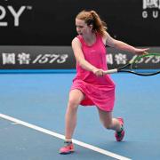 Dunfermline tennis star Anna McBride retained her women's singles and doubles titles at the Australian Open's event for players with intellectual impairment .