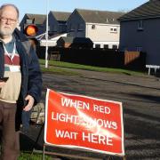 Cllr Dempsey at the site of the recent road repairs on Moray Way, Dalgety Bay