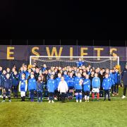 Douglas Chapman MP (far left) and Gez Gibson (far right) line up with some of the 105 registered girls currently playing for Swifts FC.