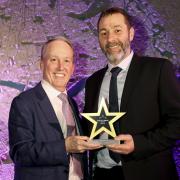 Neil Graham (right) receives his award from Ray O'Toole, non-executive chairman of Stagecoach.