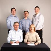 Dave and Doreen Riddell with sons Michael and Gavin and fellow director Mark Grant.