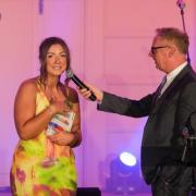 Robyn Drummond, pictured with awards host Bryan Burnett, reflects on her 2023 win at the Community Champion Awards