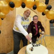 Happy Days Club chairman Danny Kinloch and original organiser, Cathy Henderson, celebrate the charity's 40th anniversary.