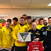 David Laming receiving a special birthday gift from the Dunfermline Athletic squad.