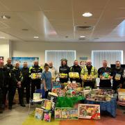 Members of the Kingdom of Fife Advanced Motorists hand over the Easter gifts at the Victoria Hospital.