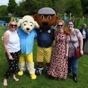 Hillend mums Emma Cockburn, Stephanie Hubach-Thomson and Lesa MacKenzie with the Hillend Hound and Sammy the Tammy at the new playpark's official opening.