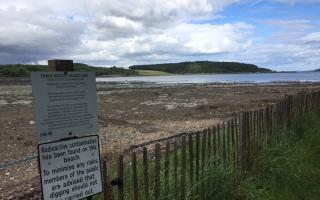 The signs will remain, for now, but the remediation works at Dalgety Bay have been completed.