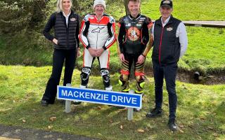 Niall Mackenzie, pictured with son Taylor, and Knockhill's Jillian Shedden and Stuart Gray, saw the road to the venue named in his honour.